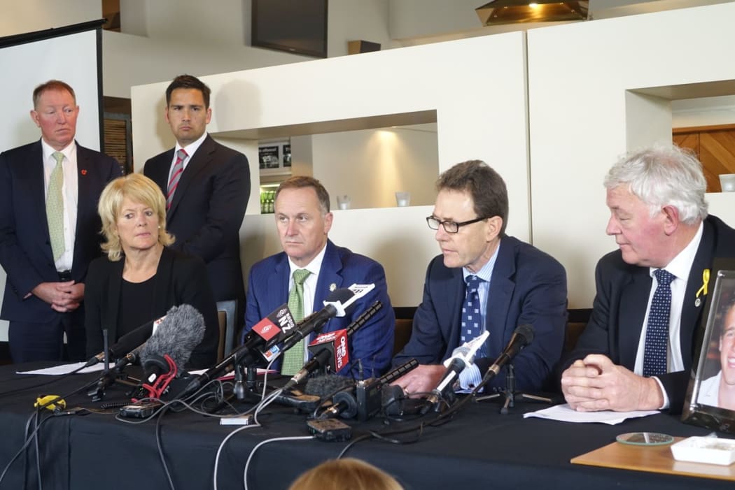 Seated from left, Pip Dunphy, John Key, Colin Smith and Bernie Monk at the Pike River press conference. Ministers Nick Smith, left, and Simon Bridges watch on.