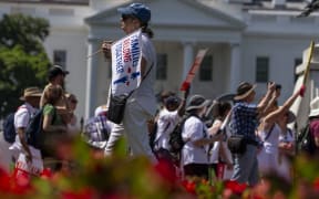 Demonstrators in front of the White House prior to a march against the separation of immigrant families.