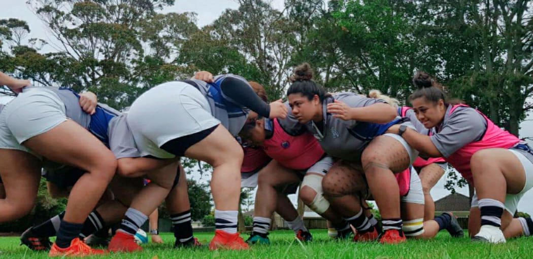 The Manusina women's rugby team pack down a scrum in training.