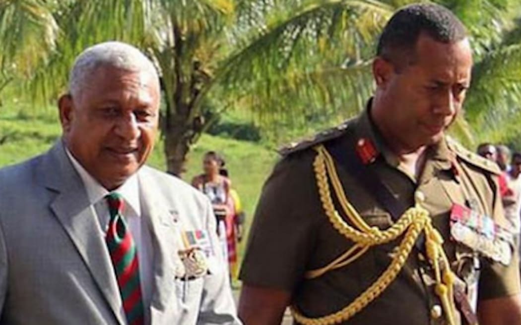 Former Fiji Prime Minister Frank Bainimarama and army commander Jone Kalouniwai (right).