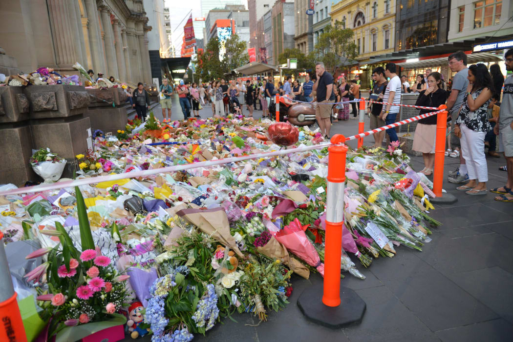 Floral tributes to the victims were laid along the street in the days after the crash.