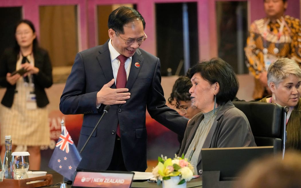 Vietnam's Foreign Minister Bui Thanh Son (L) talks with New Zealand's Foreign Minister Nanaia Mahuta prior to the start of the ASEAN Post Ministerial Conference with New Zealand at the Association of Southeast Asian Nations (ASEAN) Foreign Ministers' Meeting in Jakarta on July 13, 2023.