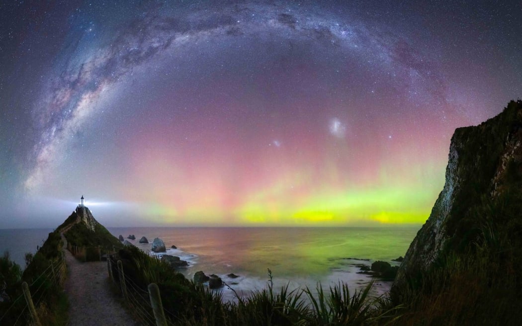 Aurora and the Milky Way at Nugget Point lighthouse.