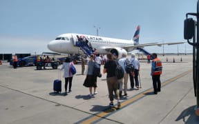 New Zealanders boarding a flight back home after being stranded in Peru due to Covid-19.