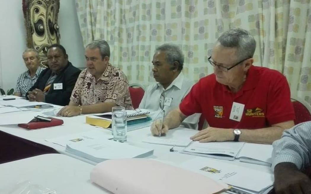 The 2016 PNGRFL AGM in Port Moresby. Among those present are Chair Sandis Tsaka, second left, Sports Minister Justin Tkatchenko, centre, and CEO Bob Cutmore, right.