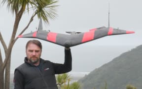 Philip Solaris with a Valkyrie drone outfitted to collect information from the sensors.