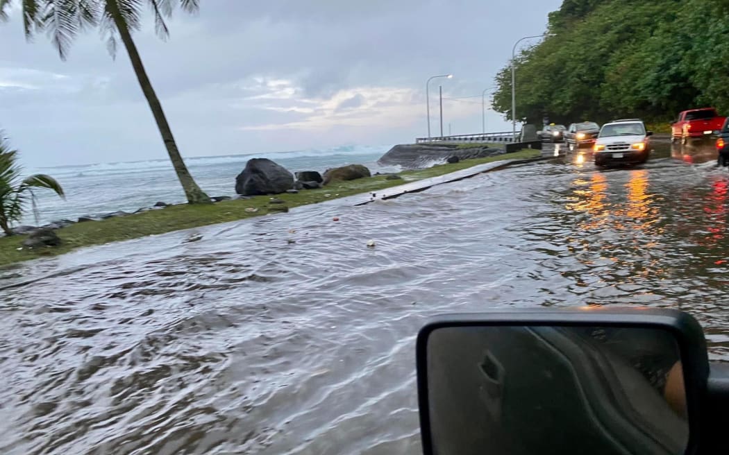 Cars negotiating floodwaters on a road near Fatu-ma-Futi in American Samoa, last week.
