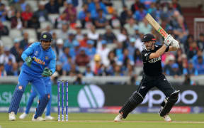 Indian wicket keeper Mahendra Singh Dhoni and New Zealand Captain Kane Williamson bats during the Cricket World Cup 2019 semi-final between India and New Zealand at Old Trafford, Manchester on 9 July 2019.