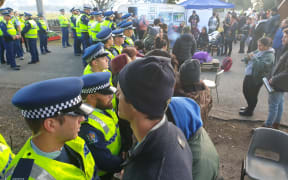 Police and some protesters at the site today.