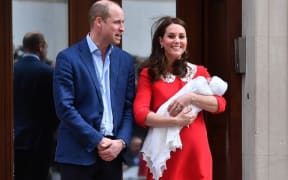 Britain's Prince William, Duke of Cambridge (L) and Britain's Catherine, Duchess of Cambridge show their newly-born son, their third child, to the media outside the Lindo Wing at St Mary's Hospital in central London.