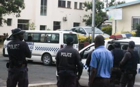 A police van arrives at Vanuatu's correctional facility carrying the arrested MPs.