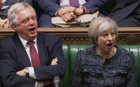 British Prime Minister Theresa May and Brexit Minister David Davis shout 'aye' during the House of Commons vote on the first stage of Brexit legislation.