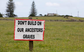 Opponents of a large housing development set to be built next to historic Maori land say they will do whatever it takes to stop it going ahead.