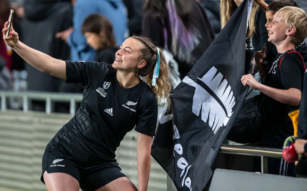 Renee Holmes of New Zealand takes selfies with fans after the Women's Rugby World Cup match between New Zealand and Australia at Eden Park in Auckland, New Zealand on Saturday October 08, 2022. Copyright photo: Aaron Gillions / www.photosport.nz