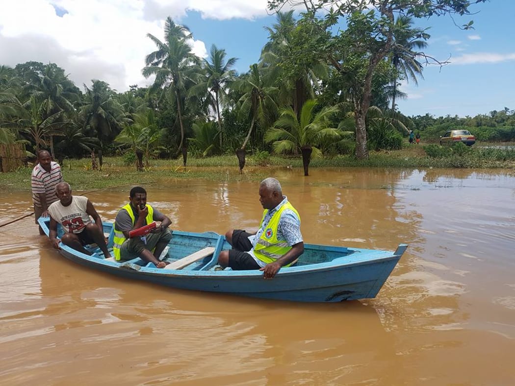 A Fiji Red Cross team assesses Waivou village, Fiji after a week of flooding in December 2016.