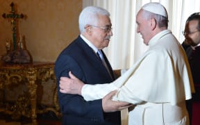 Pope Francis welcomes Mahmoud Abbas during a private audience at the Vatican.