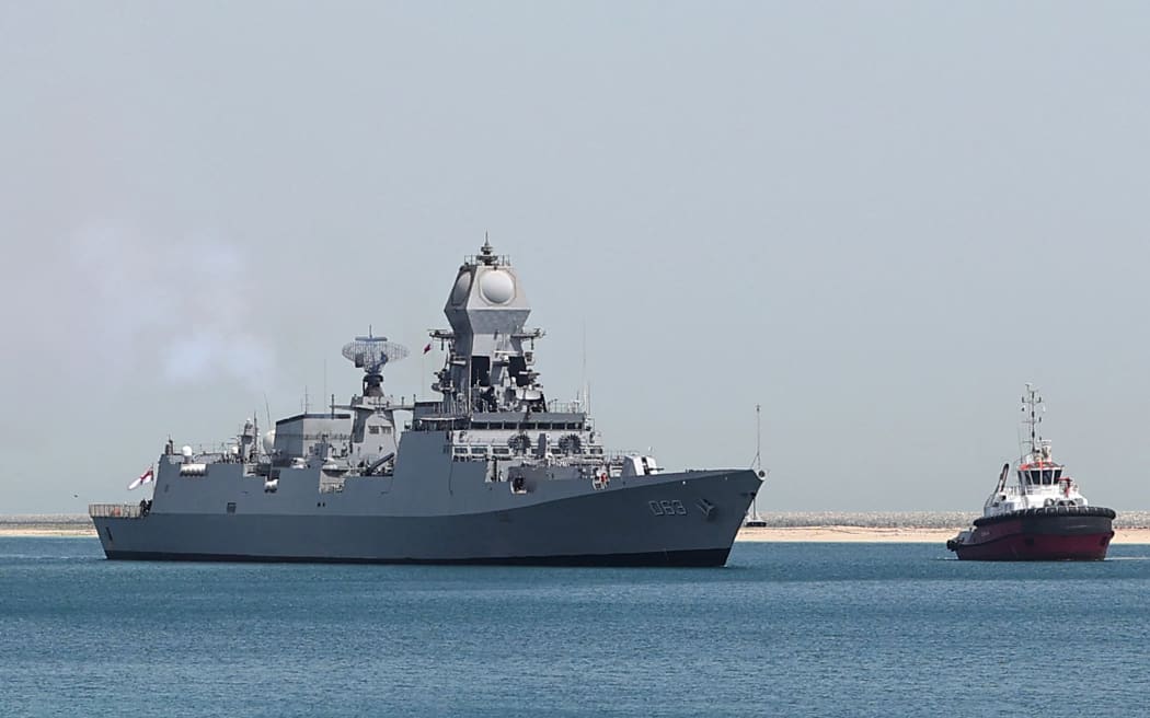 Indian Navy Warship INS Kolkata arrives at Hamad Port during the Doha International Maritime Defence Exhibition & Conference (DIMDEX) in the Qatari capital Doha on March 20, 2022. (Photo by KARIM JAAFAR / AFP)