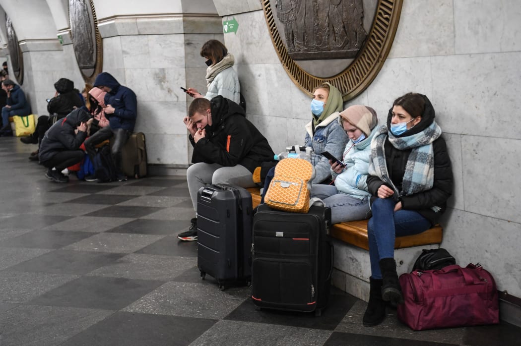 People take shelter in a metro station in Kyiv on the morning of February 24, 2022.