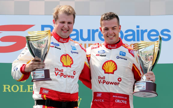 Scott McLaughlin (right) on the podium after his final race win in Melbourne.