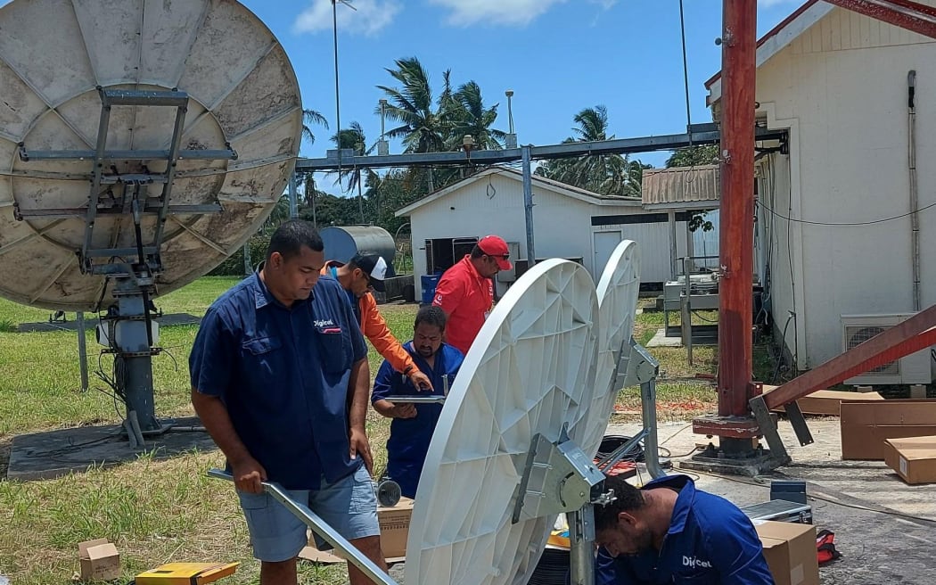 Digicel Tonga’s technical team working on satellite link equipment to restore internet connection