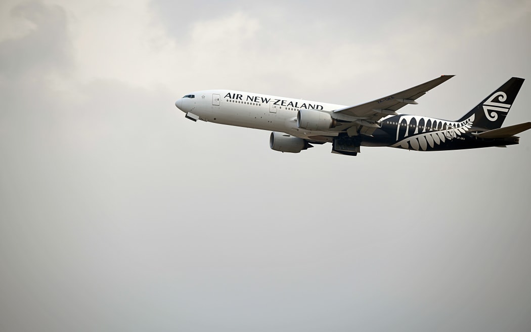 air new zealand boeing 777-219 inflight mid-air after taking off from hong kong international airport on chek lap kok island.