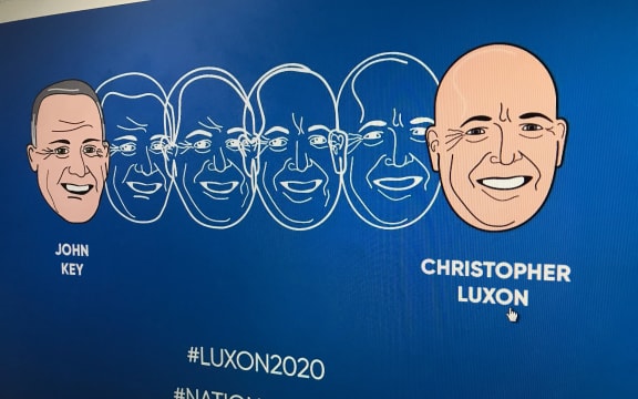 The ad is a reworking of Dick Frizzell's well-known artwork "Mickey to Tiki" showing John Key's face transforming into Christopher Luxon's.