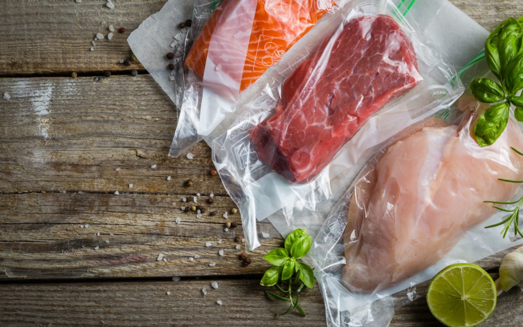 Beef, chicken and salmon in vacuum plastic bag for sous vide cooking, copy space