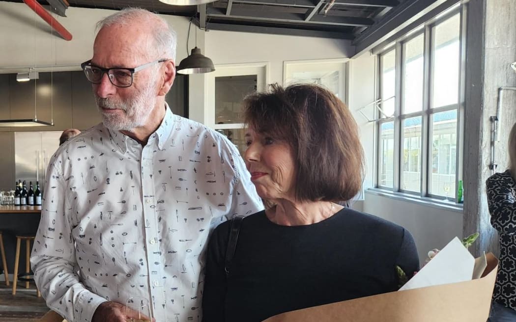 Auckland mayoral incumbent Wayne Brown and his wife Toni talking to a supporter.