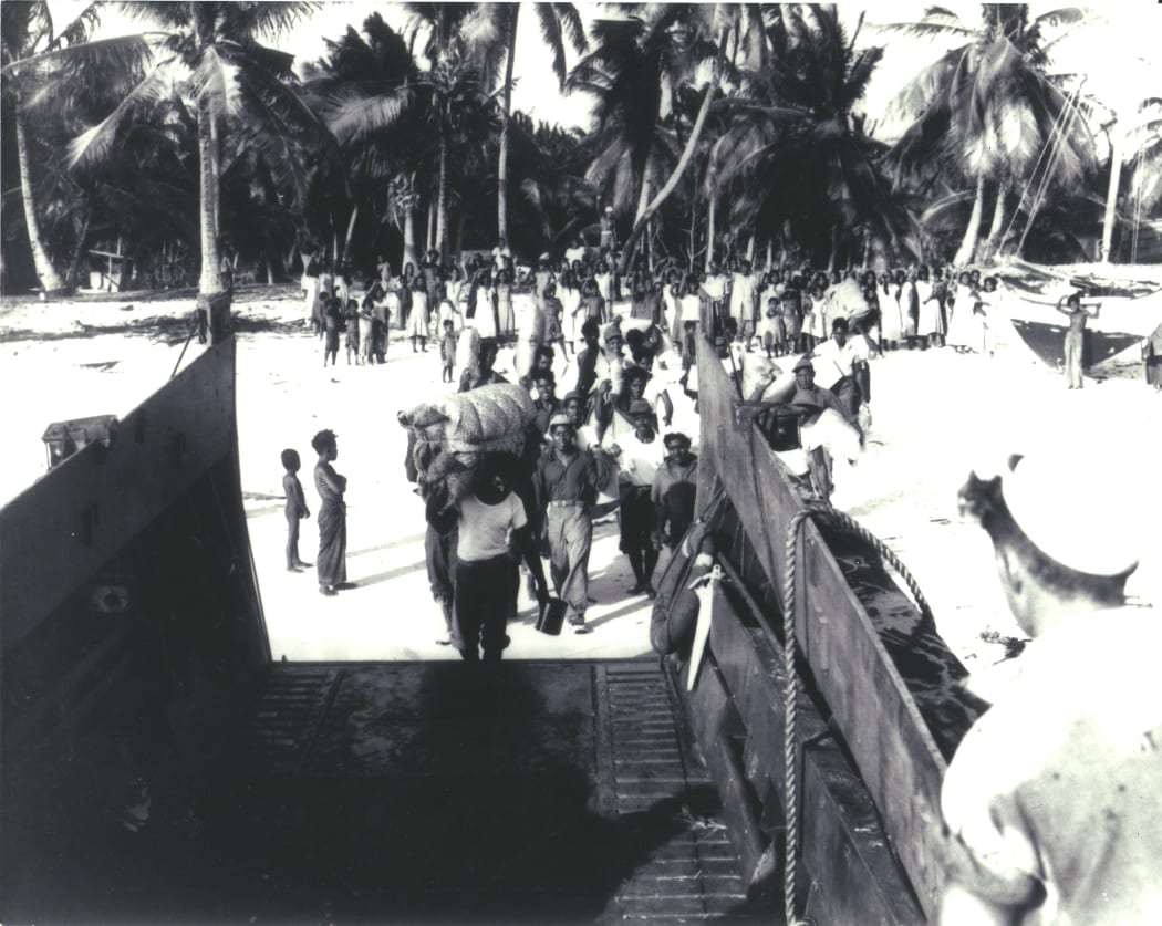 Bikinians in the Marshall Islands being evacuated from their home island after nuclear testing in the area by the US.