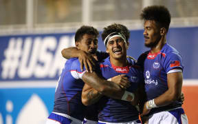 Samoa players celebrates the Cup quarter final win against Australia in Las Vegas.