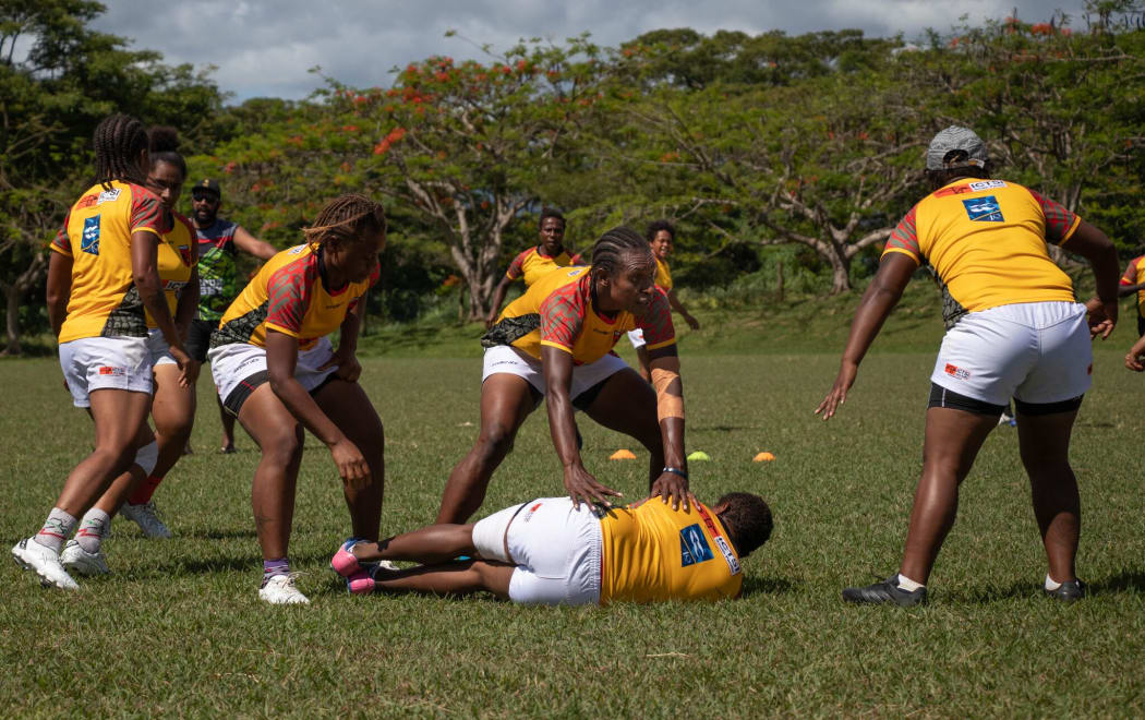 The Papua New Guinea women's rugby team are put through their paces on the training field.