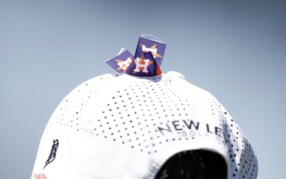 A view of the Houston Astros logos on the hat of Steven Alker in honor of his caddie Sam Workman who died earlier in 2023.