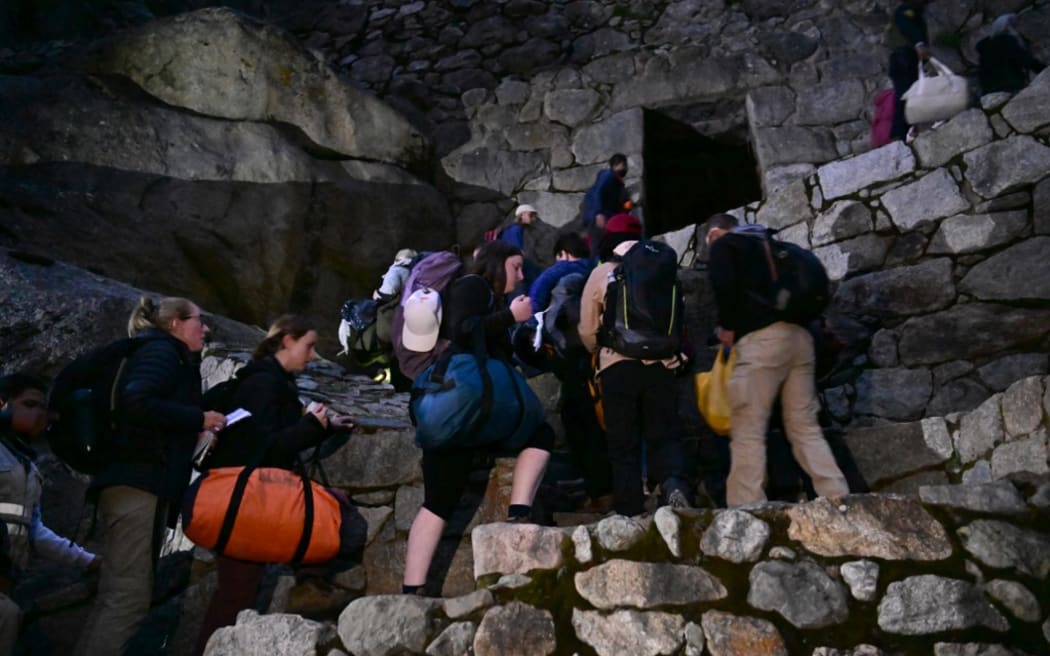 Touristes bloqués qui visitaient la citadelle inca de Machu Picchu.