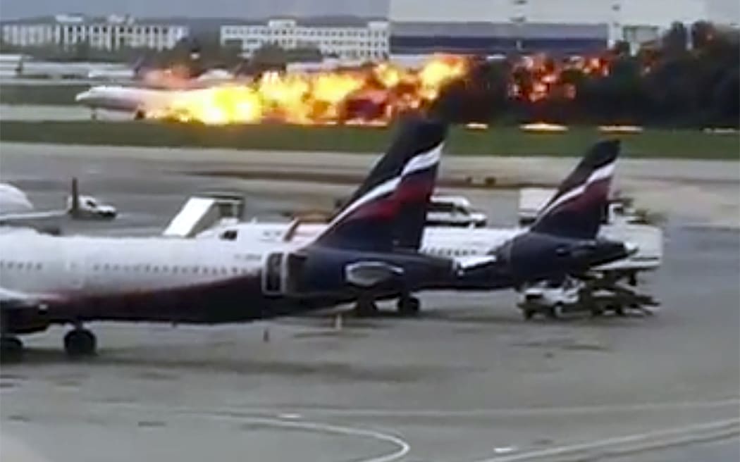 An image taken from video shows the SSJ-100 aircraft of Aeroflot Airlines on fire during an emergency landing in Sheremetyevo airport in Moscow, Russia, Sunday, May 5, 2019.