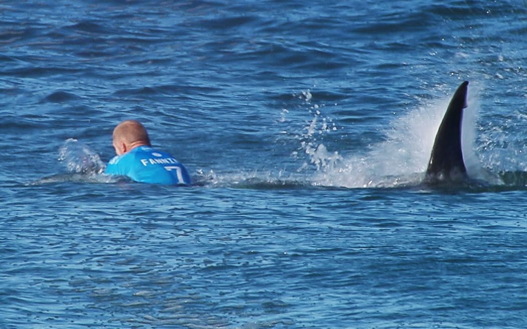 Surfer Mick Fanning is hunted by a great white shark in South Africa.