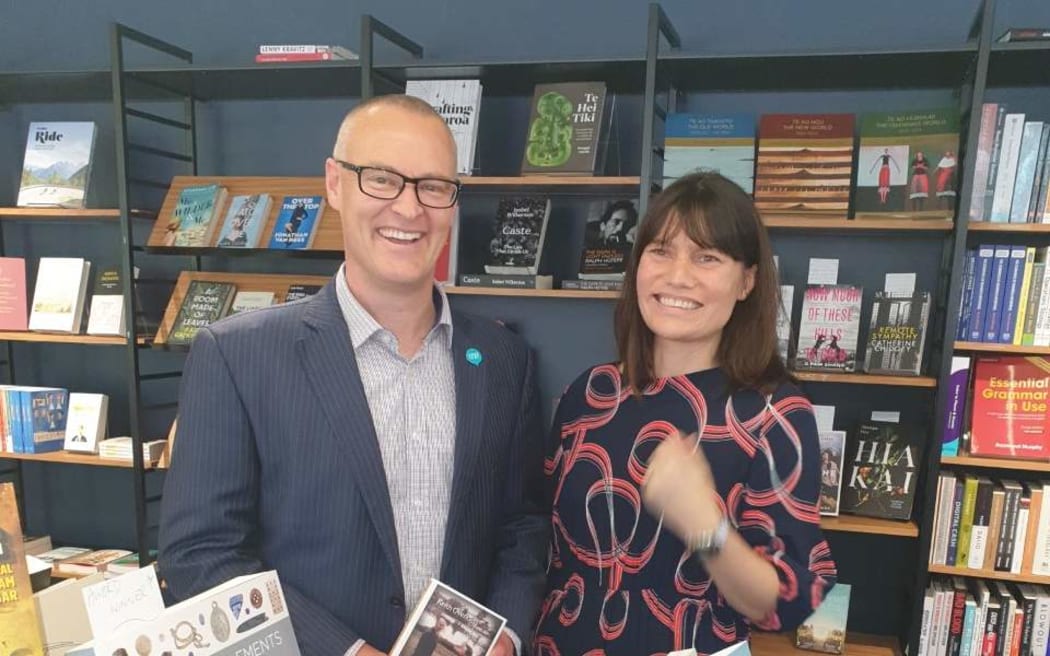 Commerce and Consumer Affairs Minister David Clark with VicBooks general manager Jessica Godfrey.