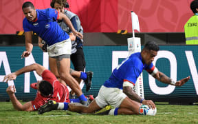Samoa's centre Rey Lee-Lo (R) scores a try  during the Japan 2019 Rugby World Cup Pool A match between Russia and Samoa at the Kumagaya Rugby Stadium in Kumagaya.