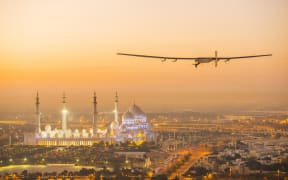Solar Impulse 2 flying over Abu Dhabi on 26 February 2015. The plane made a third successful test flight in the United Arab Emirates on 2 March.