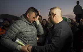 Jose Rosello (L), father of Julen who fell down a well, cries as rescue efforts continue to find the boy in Totalan in southern Spain.
