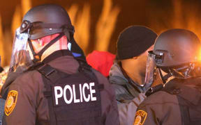 Police confront protestors in Ferguson after the shooting of Michael Brown in November.
