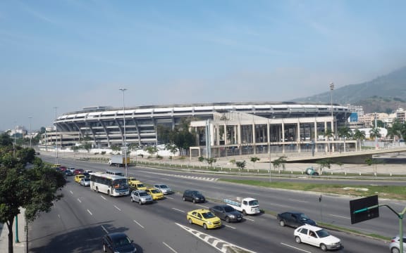 Traffic crawl past legendary Maracana Stadium, Rio de Janeiro.