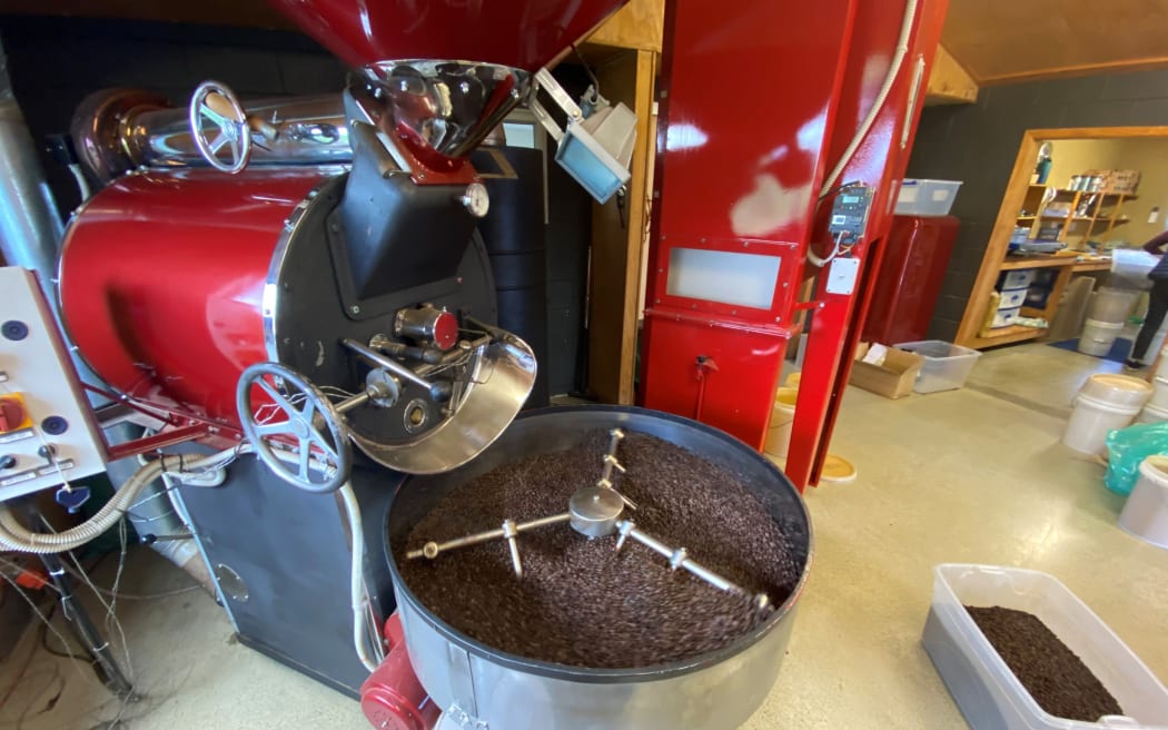 The Italian coffee roaster with destoner standing behind ready for the fresh batch of beans.