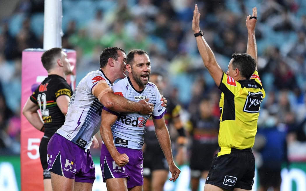 Cameron Smith celebrates scoring a try for the Melbourne Storm in the 2020 NRL grand final against the Penrith Panthers at ANZ Stadium in Sydney.