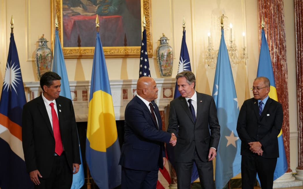 US Secretary of State Antony Blinken (2nd R) shakes hands with  Micronesia's President David Panuelo during a meeting as Palau's President Surangel Whipps Jr. (L) and Marshall Islands' President David Kabua (R) at the State Department in Washington, DC, on September 29, 2022. (Photo by SARAH SILBIGER / POOL / AFP)