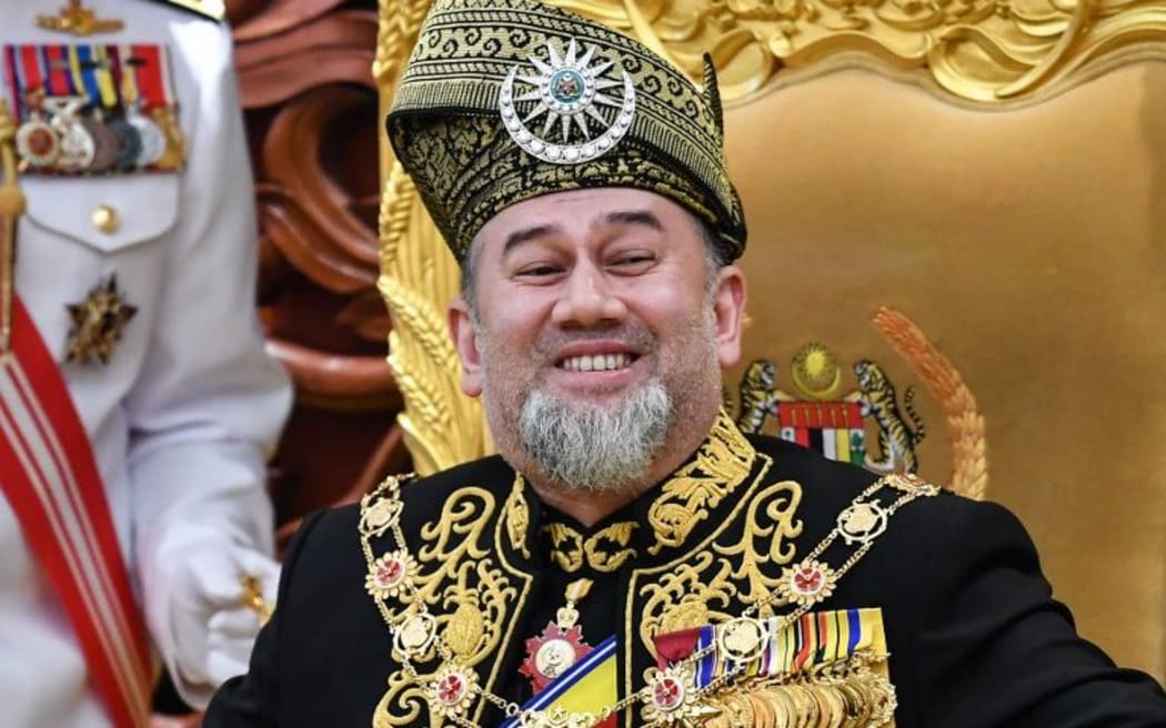 Malaysia's King Sultan Muhammad V smiles as he delivers a speech in Kuala Lumpur on July 17, 2018.