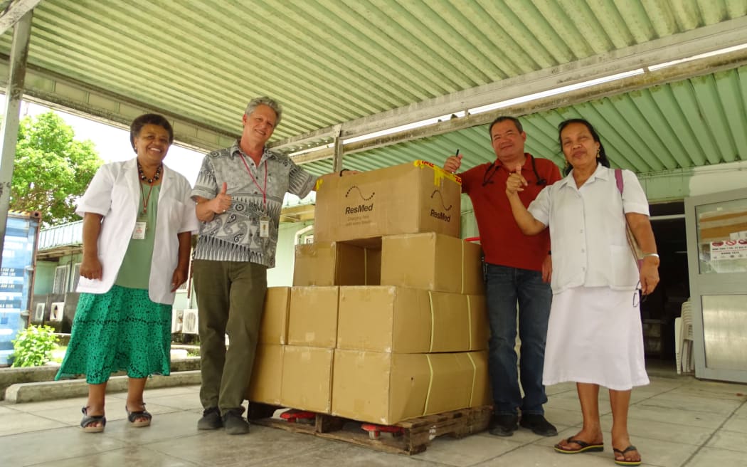 Health Secretary Jack Niedenthal, second from left, with Ministry of Health and Human Services staff and ventilators imported for use in the two Marshall Islands hospitals in preparation for responding to a Covid outbreak.