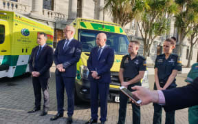St John CEO Peter Bradley (second from left) and Wellington Free CEO Mike Grant (centre) with ambulance officers and staff at Parliament today.