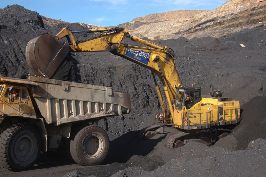 Digger loads up a truck at Stockton Coal Mine.