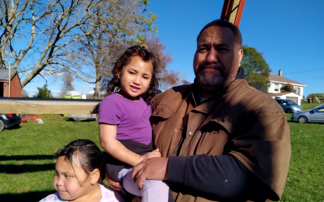 Orrin Kapua with his daughters.