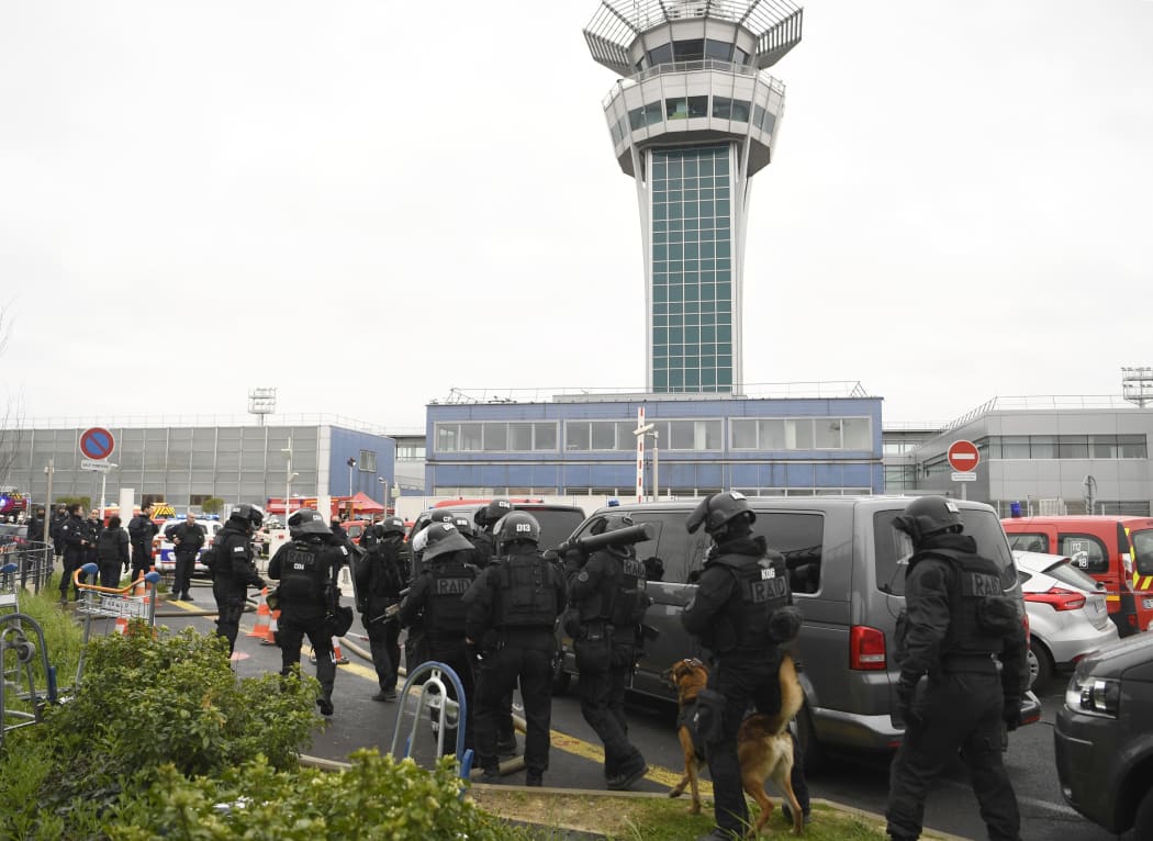 French police secure the area at Paris' Orly airport after the shooting of a man by French security forces on 18 March  2017. Security forces at Paris' Orly airport shot dead a man who took a weapon from a soldier, officials said.